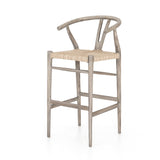Featuring Muestra Counter + Bar Stool - Weathered Grey by Four Hands at Amethyst Home. Modern curves redefine the classic wishbone-style counter stool. Vintage white all-weather wicker is woven for a dose of fresh texture within weathered grey teak framing. Cover or store indoors during inclement weather and when not in use.
Counter Stool Overall Size: 21.5. Amethyst Home provides interior design, new home construction design consulting, vintage area rugs, and lighting in the Park City metro area.