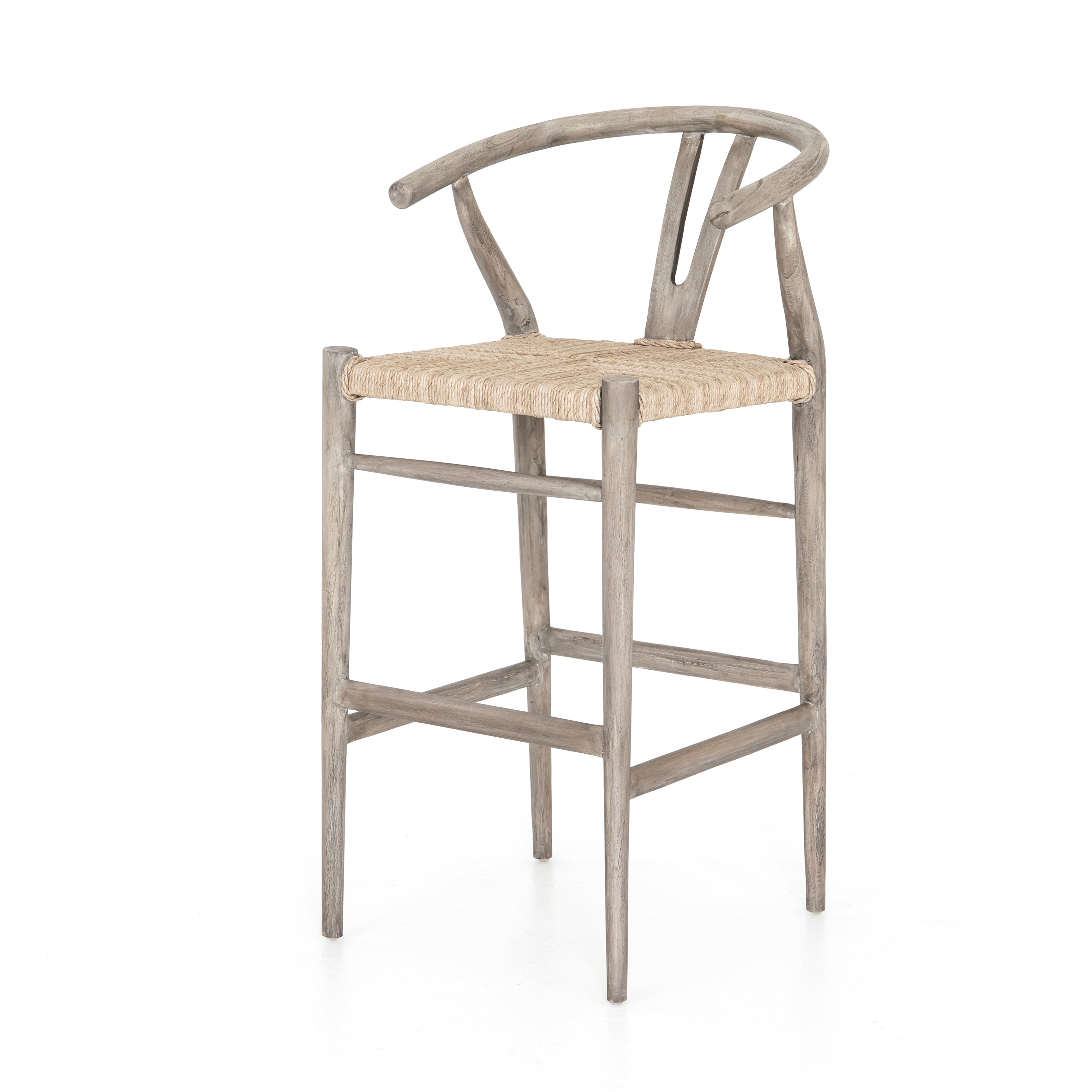 Featuring Muestra Counter + Bar Stool - Weathered Grey by Four Hands at Amethyst Home. Modern curves redefine the classic wishbone-style counter stool. Vintage white all-weather wicker is woven for a dose of fresh texture within weathered grey teak framing. Cover or store indoors during inclement weather and when not in use.
Counter Stool Overall Size: 21.5. Amethyst Home provides interior design, new home construction design consulting, vintage area rugs, and lighting in the Park City metro area.