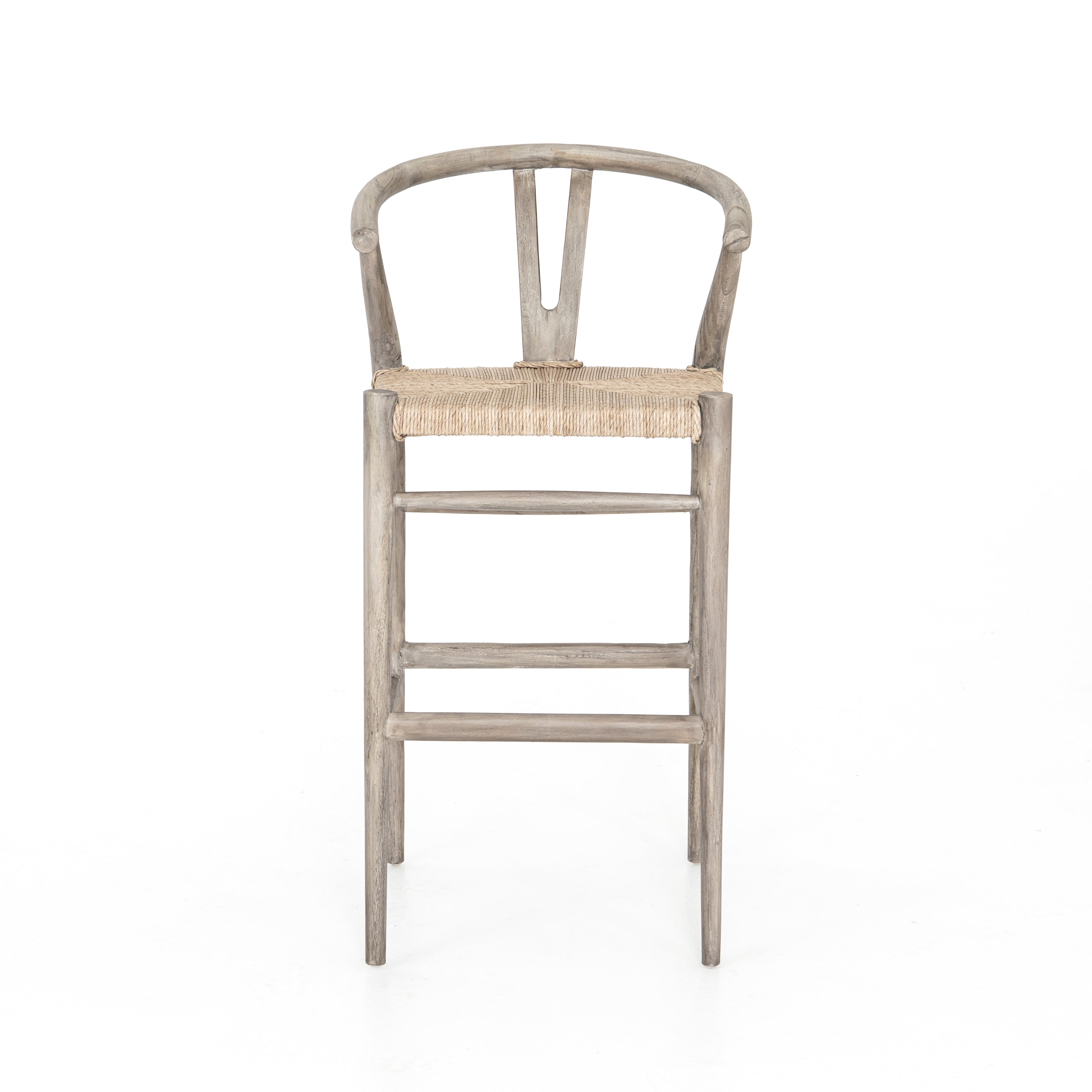 Featuring Muestra Counter + Bar Stool - Weathered Grey by Four Hands at Amethyst Home. Modern curves redefine the classic wishbone-style counter stool. Vintage white all-weather wicker is woven for a dose of fresh texture within weathered grey teak framing. Cover or store indoors during inclement weather and when not in use.
Counter Stool Overall Size: 21.. Amethyst Home provides interior design, new home construction design consulting, vintage area rugs, and lighting in the Scottsdale metro area.