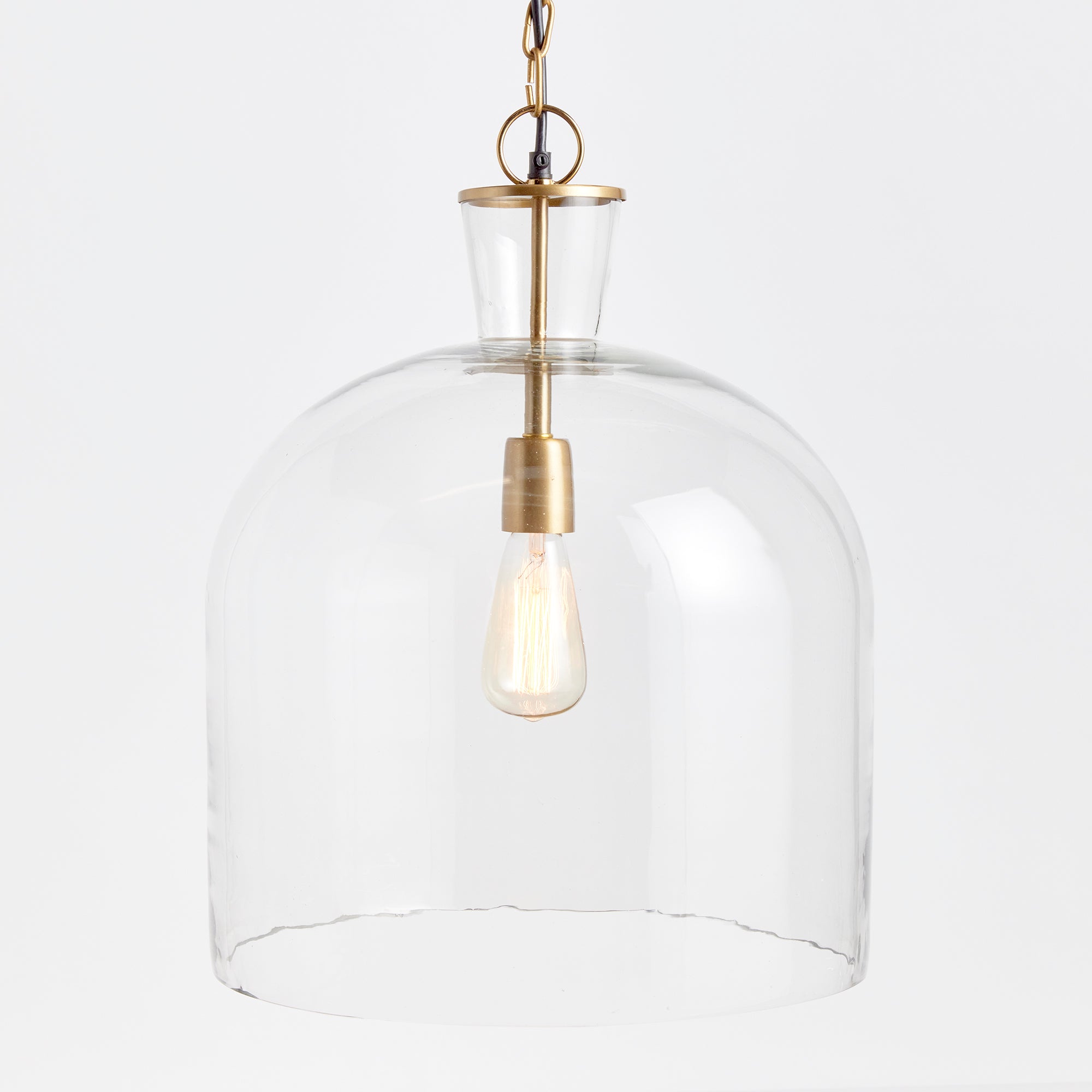A classic mix of warm brass and seeded glass in grand scale, this pendant is a traditional fixture. Over an island, in an entry or foyer, a beautiful fixture. Amethyst Home provides interior design, new construction, custom furniture, and area rugs in the Los Angeles metro area.