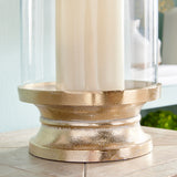 With a traditional silhouette and a snow-on-brass finish, this footed hurricane is at home in the fresh traditional setting. Add a tall pillar candle and enjoy the warm glow. Amethyst Home provides interior design, new construction, custom furniture, and area rugs in the Austin metro area.