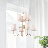 The Kinley Chandelier is a fresh take on a classic two-tiered shape. Subtle modern touches like the tapered shade and gold finish complete the look. Amethyst Home provides interior design, new construction, custom furniture, and area rugs in the Scottsdale metro area.