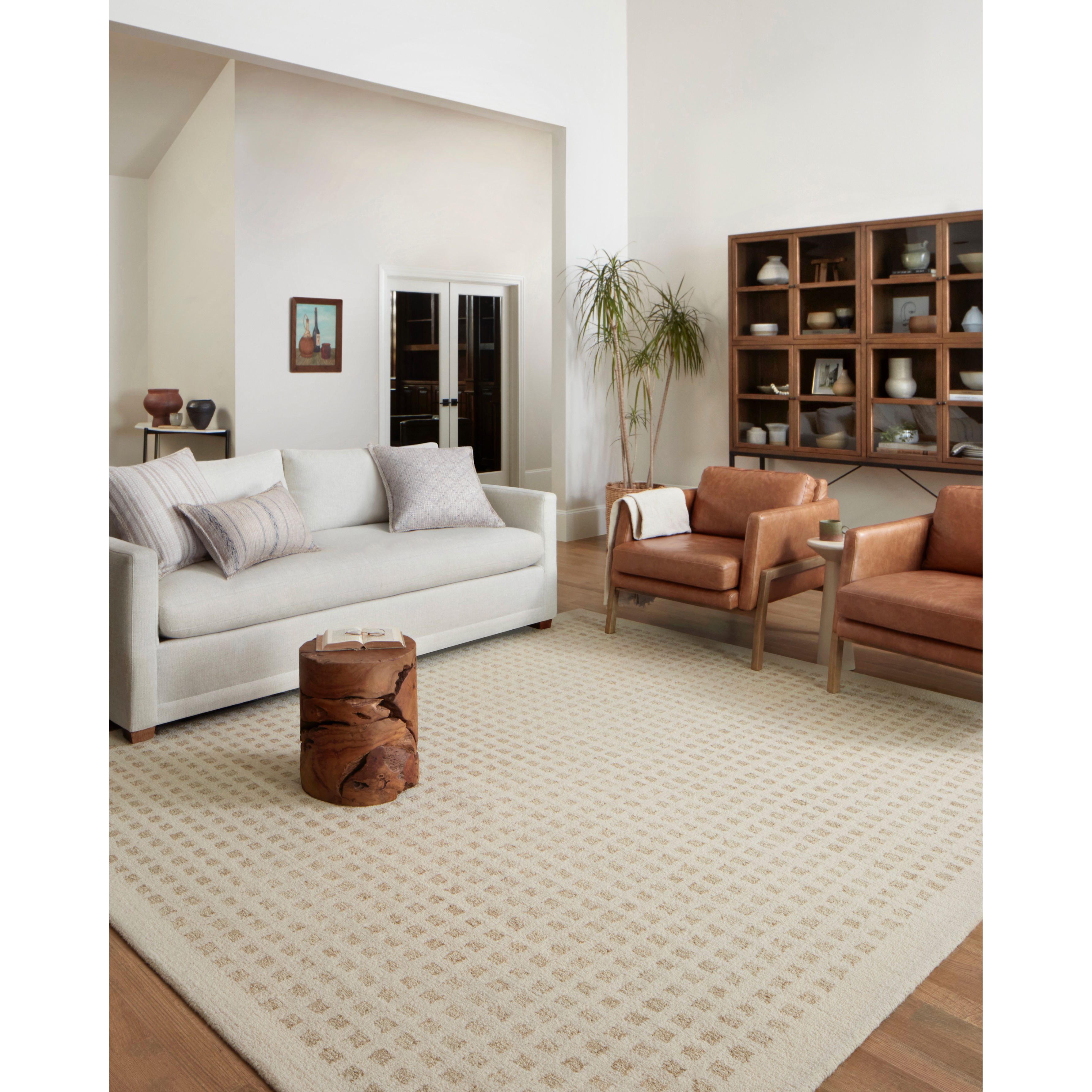 Featuring Polly Chris Loves Julia x Loloi Ivory / Natural Rug by Loloi at Amethyst Home. Hand-tufted of wool and jute pile, the Polly Ivory / Natural rug for Chris Loves Julia x Loloi brings a fresh take on modern yet classic designs. With striking gridded designs toned down by a neutral color palette, Polly is a timeless choice for any room. Polly is also GoodWeave certified, ensuring o. Amethyst Home provides interior design, new construction, custom furniture, and rugs for the Omaha metro area.