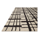 Featuring Polly Chris Loves Julia x Loloi Black / Ivory Rug by Loloi at Amethyst Home. Hand-tufted of wool and jute pile, the Polly Black / Ivory rug for Chris Loves Julia x Loloi brings a fresh take on modern yet classic designs. With striking gridded designs toned down by a neutral color palette, Polly is a timeless choice for any room. Polly is also GoodWeave certified, ensuring o. Amethyst Home provides interior design, new construction, custom furniture, and rugs for the Calabasas metro area.