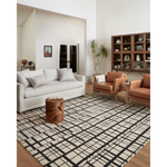 Featuring Polly Chris Loves Julia x Loloi Black / Ivory Rug by Loloi at Amethyst Home. Hand-tufted of wool and jute pile, the Polly Black / Ivory rug for Chris Loves Julia x Loloi brings a fresh take on modern yet classic designs. With striking gridded designs toned down by a neutral color palette, Polly is a timeless choice for any room. Polly is also GoodWeave certified, ensuring our . Amethyst Home provides interior design, new construction, custom furniture, and rugs for the Dallas metro area.