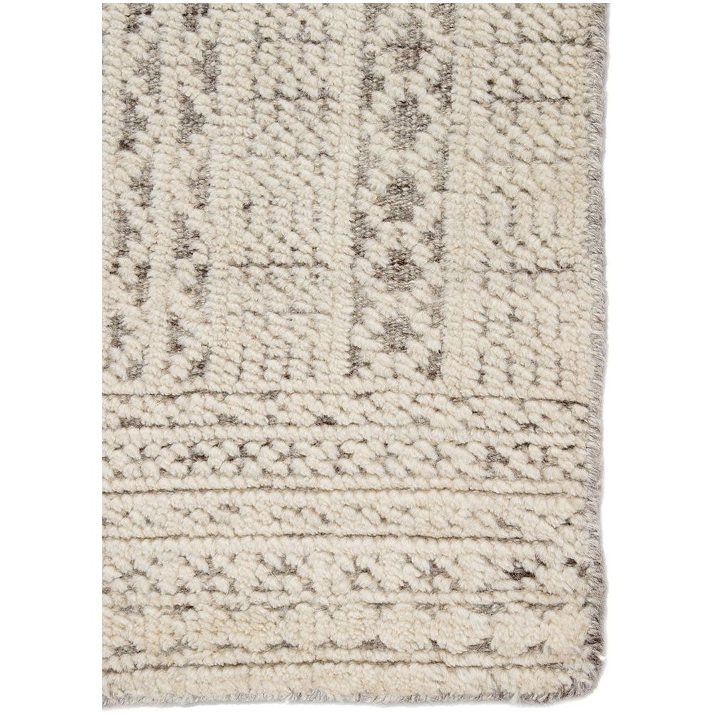 Featuring Reign Sharkskin/Quiet Gray Hand-Knotted Rug by Jaipur Living at Amethyst Home. The captivating Reign collection introduces detail-rich design and inviting carved pile to contemporary and traditional homes alike. The hand-knotted Jadene rug boasts an intricate geometric design in a neutral ivory and light gray colorway. This wool rug's textured.  Amethyst Home provides interior design, new home construction design consulting, vintage area rugs, and lighting in the Laguna Beach metro area.