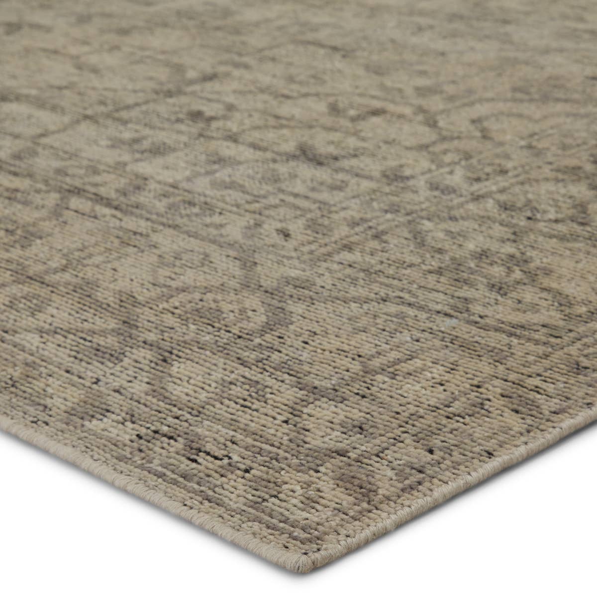 Featuring Rhapsody Camber Hand-Knotted Rug by Jaipur Living at Amethyst Home. The Rhapsody Camber Area Rug features heirloom-quality designs of stunningly abrashed Old World patterns. The durable wool, hand knotted Camber area rug boasts a beautifully washed, winding medallion design. The tonal gray and cream palette is accented by hints of deep black for adde.  Amethyst Home provides interior design, new home construction design consulting, vintage area rugs, and lighting in the Tampa metro area.