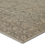 Featuring Rhapsody Camber Hand-Knotted Rug by Jaipur Living at Amethyst Home. The Rhapsody Camber Area Rug features heirloom-quality designs of stunningly abrashed Old World patterns. The durable wool, hand knotted Camber area rug boasts a beautifully washed, winding medallion design. The tonal gray and cream palette is accented by hints of deep black for adde.  Amethyst Home provides interior design, new home construction design consulting, vintage area rugs, and lighting in the Tampa metro area.