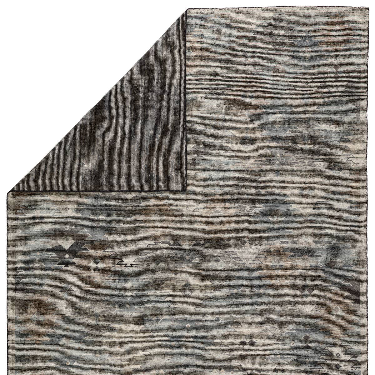 Featuring Rize Nakoda Hand-Knotted Rug by Jaipur Living at Amethyst Home. The Rize Nakoda Area Rug offers intricate and delicately designed global patterns to the modern home. A dynamic tribal motif creates an all-over design on the artistically distressed Nakoda area rug. In a black, tan, white, and blue colorway, this durable hand-knotted wool accent blend.  Amethyst Home provides interior design, new home construction design consulting, vintage area rugs, and lighting in the Houston metro area.