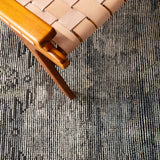 Featuring Rize Nakoda Hand-Knotted Rug by Jaipur Living at Amethyst Home. The Rize Nakoda Area Rug offers intricate and delicately designed global patterns to the modern home. A dynamic tribal motif creates an all-over design on the artistically distressed Nakoda area rug. In a black, tan, white, and blue colorway, this durable hand-knotted wool accent b.  Amethyst Home provides interior design, new home construction design consulting, vintage area rugs, and lighting in the Kansas City metro area.