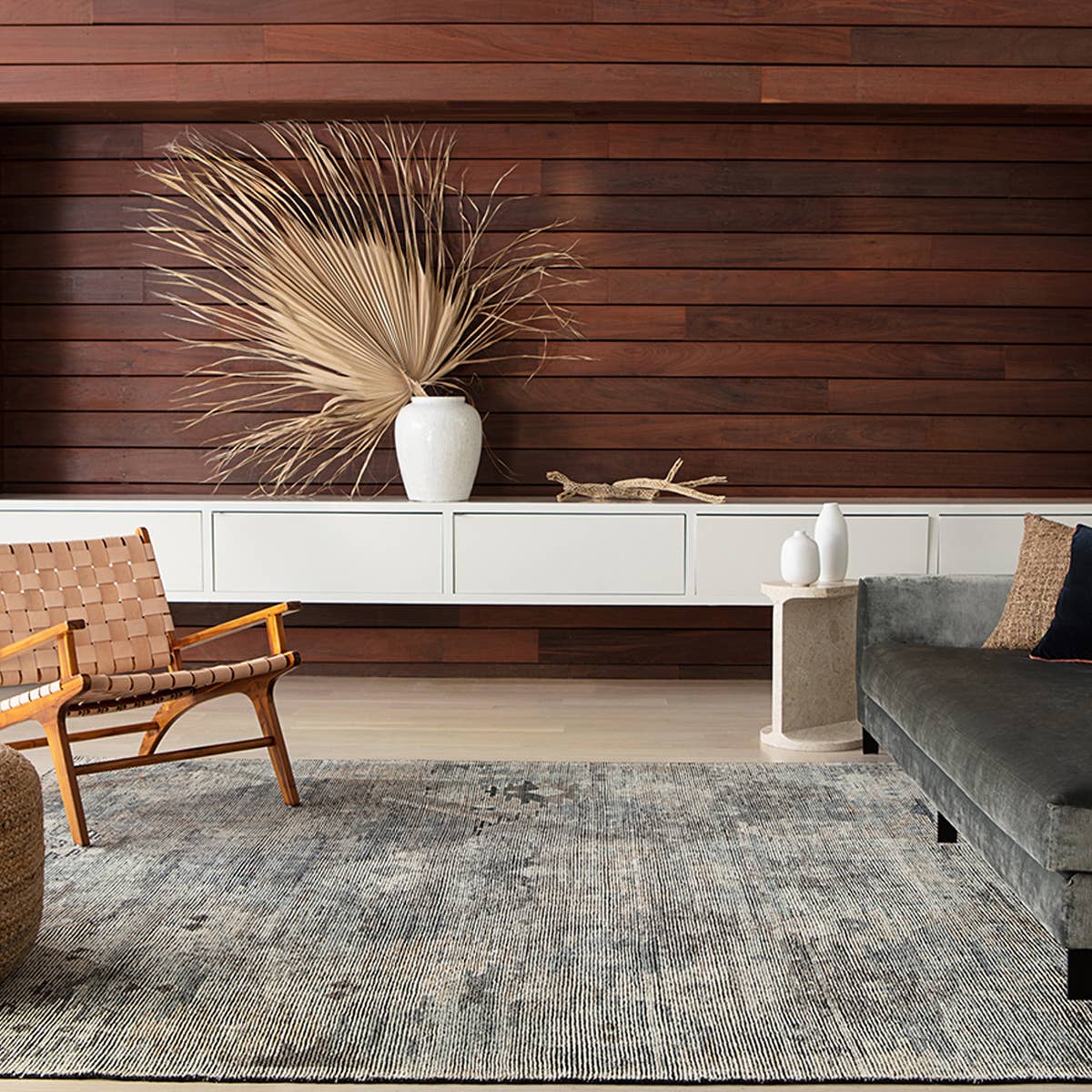 Featuring Rize Nakoda Hand-Knotted Rug by Jaipur Living at Amethyst Home. The Rize Nakoda Area Rug offers intricate and delicately designed global patterns to the modern home. A dynamic tribal motif creates an all-over design on the artistically distressed Nakoda area rug. In a black, tan, white, and blue colorway, this durable hand-knotted wool accent.  Amethyst Home provides interior design, new home construction design consulting, vintage area rugs, and lighting in the Newport Beach metro area.