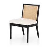 Featuring Antonia Cane Brushed Ebony Armless Dining Chair by Four Hands at Amethyst Home. We love the retro style the natural cane of this Antonia Cane Brushed Ebony Armless Dining Chair brings to a dining room. 
Overall Dimensions: 22.25"W x 23.50"L x 33"HColors: Light Natural Cane, Brushed Ebony, Savile FlaxMaterials: Cane, Solid Nettlewood, 92% Pl, 8% L.  Amethyst Home provides interior design, new home construction design consulting, vintage area rugs, and lighting in the Nashville metro area.