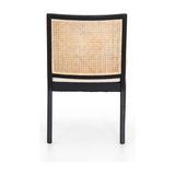 Featuring Antonia Cane Brushed Ebony Armless Dining Chair by Four Hands at Amethyst Home. We love the retro style the natural cane of this Antonia Cane Brushed Ebony Armless Dining Chair brings to a dining room. 
Overall Dimensions: 22.25"W x 23.50"L x 33"HColors: Light Natural Cane, Brushed Ebony, Savile FlaxMaterials: Cane, Solid Nettlewood, 92% Pl, 8% Li.  Amethyst Home provides interior design, new home construction design consulting, vintage area rugs, and lighting in the Monterey metro area.