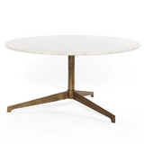 Featuring Helen Round Coffee Table by Four Hands at Amethyst Home. Simple, sophisticated style. The Helen Round Coffee Table has a slim tripod base of raw brass supports a rounded tabletop of polished white marble. Petite scale perfect for smaller spaces or rooms with a sectional.
Overall Dimensions: 32"W x 32"L x 16.50"H
Colors: Raw Brass, Polished Whi.  Amethyst Home provides interior design, new home construction design consulting, vintage area rugs, and lighting in the Kansas City metro area.