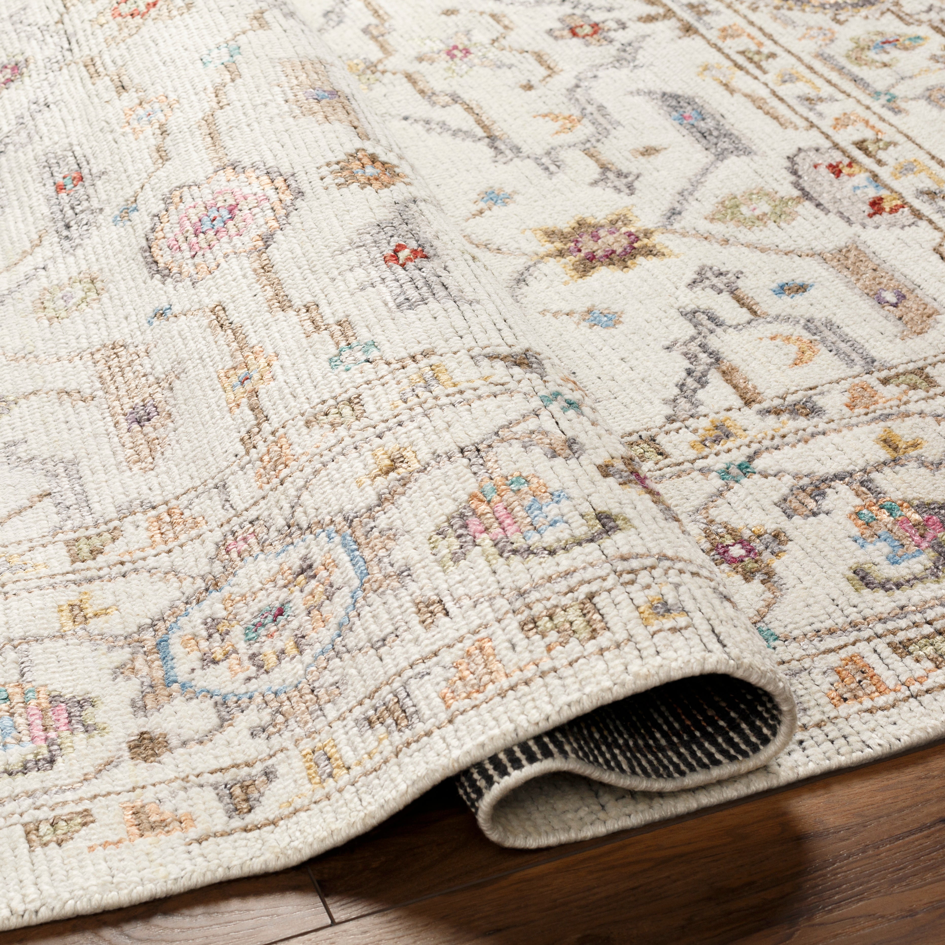 Featuring Kushal Freya Hand-Knotted Rug by Surya at Amethyst Home. The Kushal Freya rug is a stylish vintage-inspired piece crafted from a blend of soft viscose and wool. The lush cream tones, contrasted with pastel highlights, creates a bright and bold statement for any bedroom. The perfect addition for any interior, the Kushal Rug will bring a touch of class to your home.. Amethyst Home provides interior design, new construction, custom furniture, and area rugs in the Dallas metro area. KUS-2306