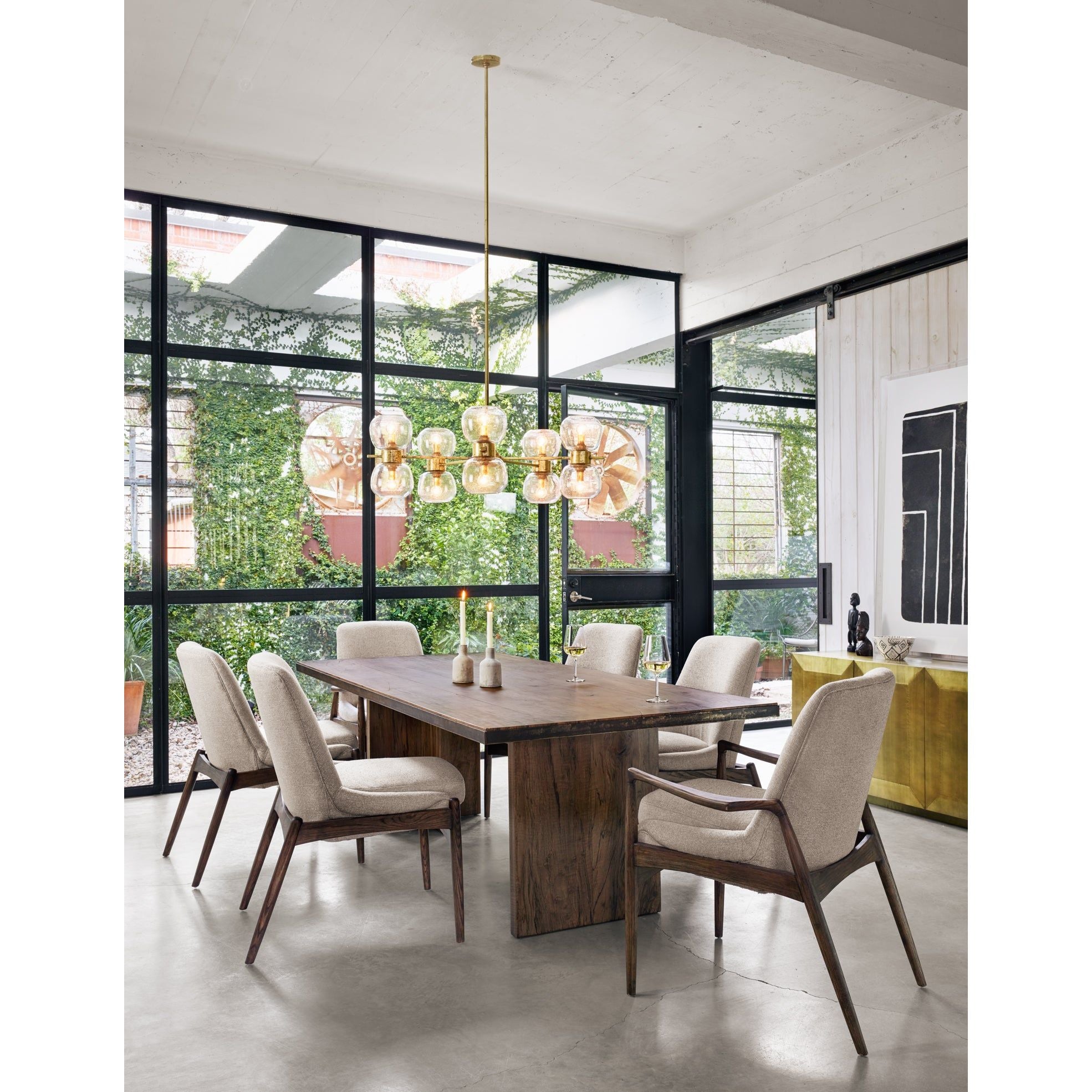 Featuring Cross Spalted Alder Dining Table by Four Hands at Amethyst Home. The Cross Spalted Alder Dining Table features an iron strapping with a brushed gold finish adds a rustic, industrial edge to a substantial plank table. Beautiful graining marks simple, cross-shaped trestles and table top.
Overall Dimensions: 94"W x 42"L x 30"HColors: Dark Spalted Primav.  Amethyst Home provides interior design, new home construction design consulting, vintage area rugs, and lighting in the Tampa metro area.