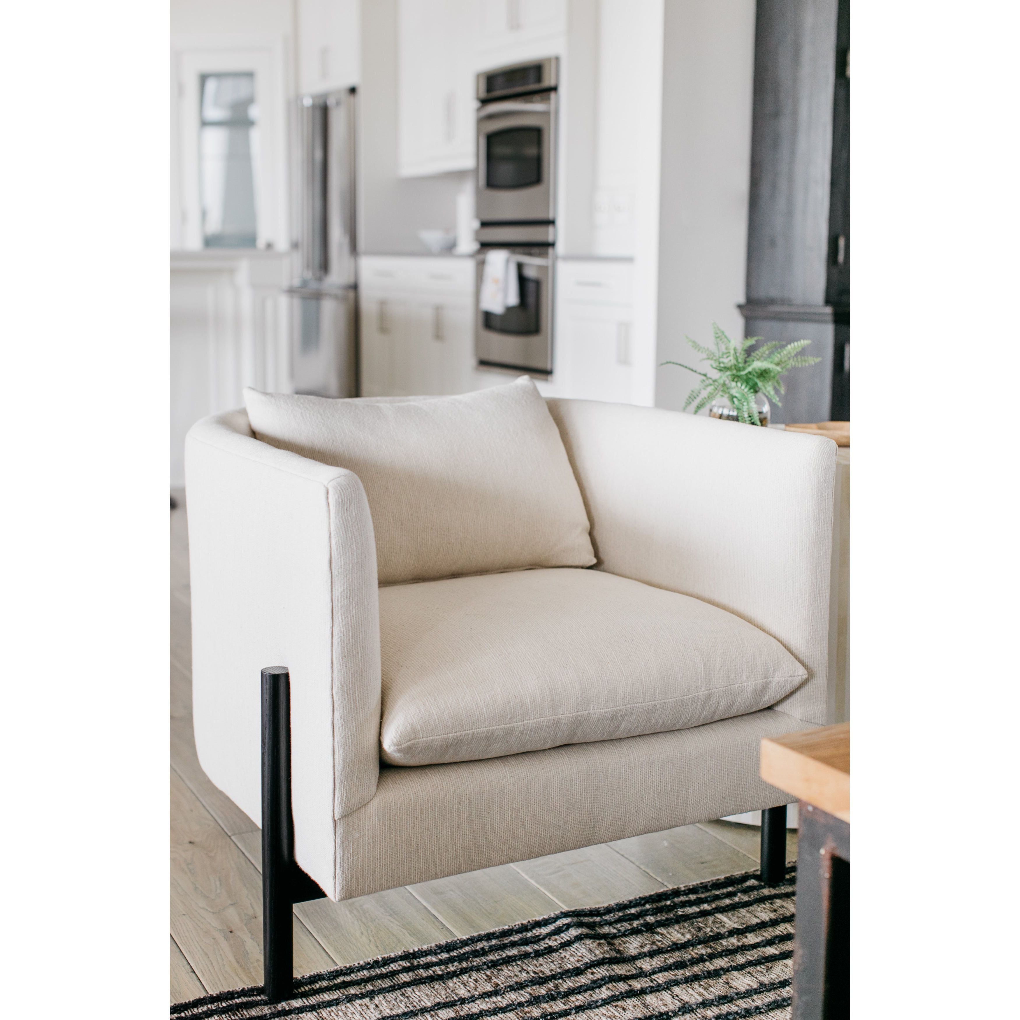 A piece we lovingly refer to as the "three legged-dog" to our clients, the Sullivan Aristocosi Linen Club Chair from Verellen is a beautiful statement piece from every angle. The 360 degree attention to detail makes it a striking piece in open concept spaces. This chair sits wonderfully for mounted televisions or with conversation and a glass of wine in the evening.