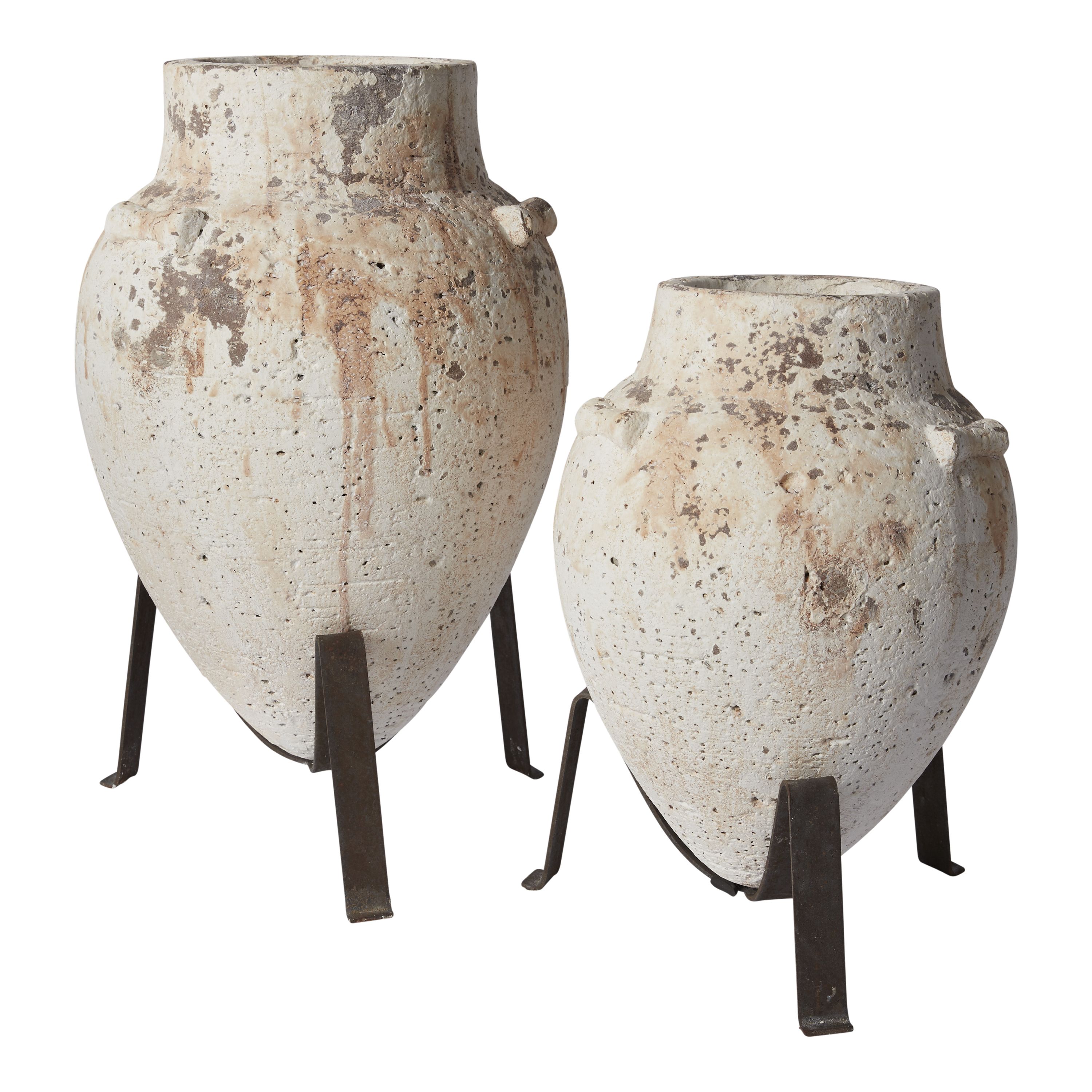 This Tuscan Plant Stand takes us to ancient times. Including a cement vase atop an iron three legged stand, this gives a gorgeous, organic vessel for your plant babies. Color variations occur within each handmade vase.