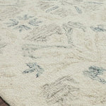 Hooked of 100% wool pile by skilled artisans in India, the Norabel Collection feels naturally soft underfoot. Norabel features designs that balance botanical motifs in delicate, variegated colors that resonate for today's home.  Hooked 100% Wool NOR-02 Ivory / Grey