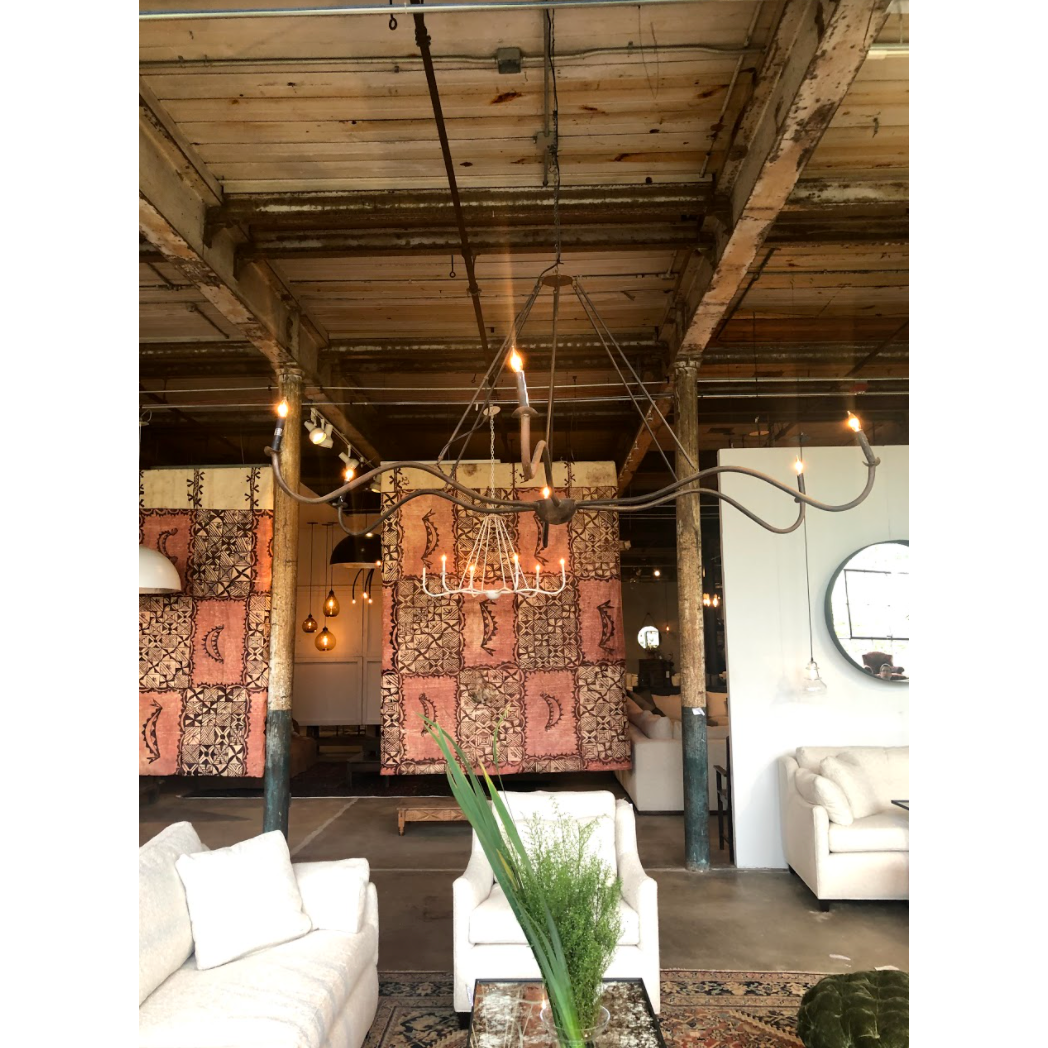 Add unique and modern lighting to a room with this Spider Chandelier from Cisco Brothers. The curved arms add beautiful sight lines to the fixture and plenty of light. This light fixture sets any room apart and comes available in either a "rust" or "flat black" finish in three different sizes.