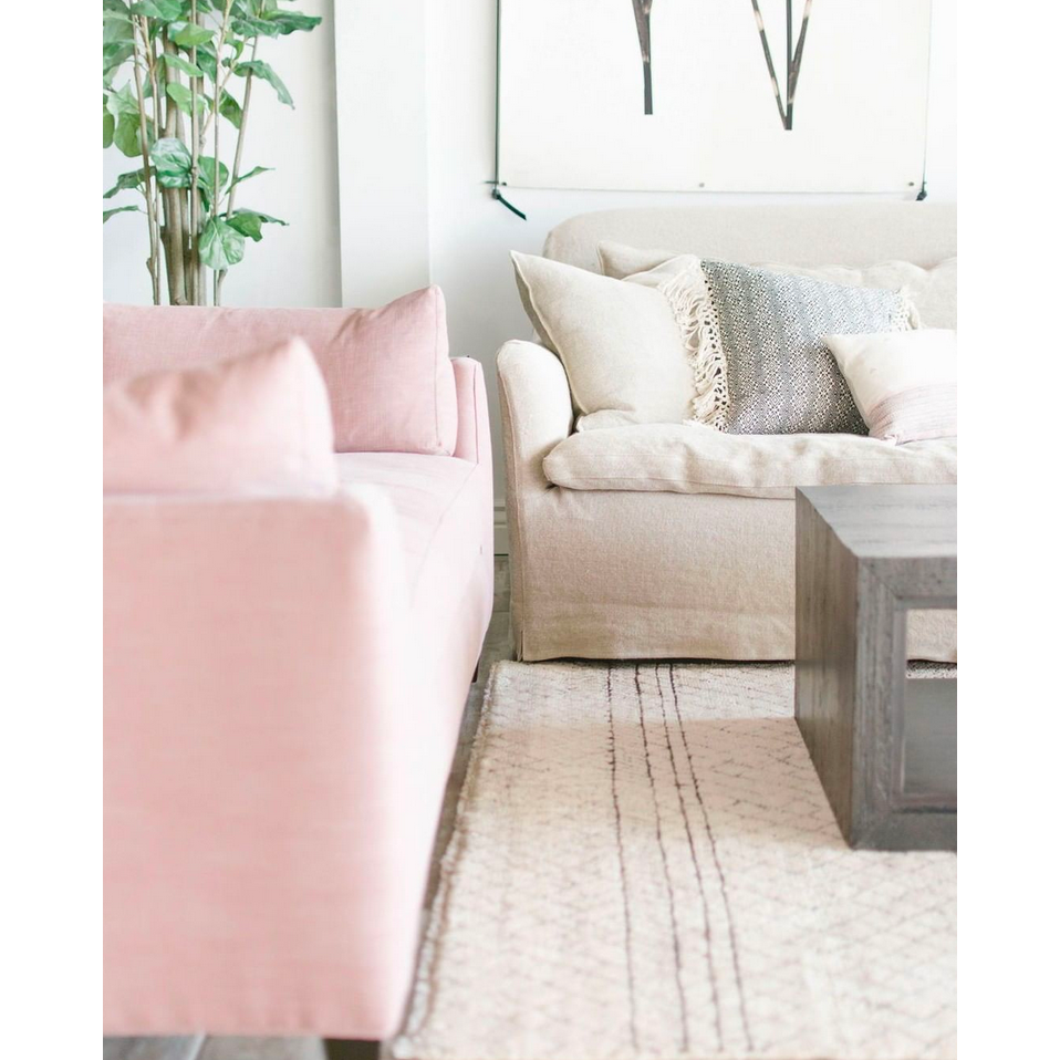 Featuring Hazel Sofa Family by Cisco Brothers at Amethyst Home. With pleats on the arms and a comfortable bench seat, the Hazel Sofa Family by Cisco Brothers effortlessly combines style and serenity. This sofa is guaranteed to make your living room look comfortable and cozy. Ideal spot to catch a breath during your weekday rush, or to enjoy a movie marathon d. Amethyst Home provides interior design, new home construction design consulting, vintage area rugs, and lighting in the Austin metro area.