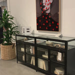 This Shadow Box Sideboard gives your inner collector a place to play. Store prized possessions behind clear glass fronts, with black-finished metal casing and brass hardware for contrast. Amethyst Home provides interior design, new home construction design consulting, vintage area rugs, and lighting in the Newport Beach metro area.