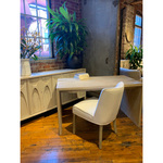 Featuring Merwin Desk by Dovetail at Amethyst Home. The simple construction of our Merwin Desk highlights the inherent beauty of the wood. Visible grain and knots give each piece its warm, individual character, and the open design leaves space for inspired styling. The whitewash finish brings a rustic, farmhouse feel to any office, living room, or other sp.  Amethyst Home provides interior design, new home construction design consulting, vintage area rugs, and lighting in the Charlotte metro area.