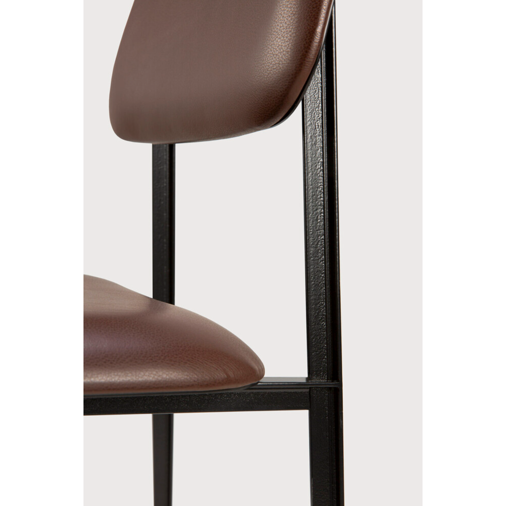 Featuring DC Dining Chair - Chocolate Leather by Ethnicraft at Amethyst Home. This DC Dining Chair is beautiful, minimalistic metal silhouette that would add an air of elegance to your dining table or kitchen. We love the details of the angled metal and the simplicity of this stunning chair.
Dimensions: 17"w x 19"d x 32.5"h Weight: 19 lbs
Seat Height: 20".  Amethyst Home provides interior design, new home construction design consulting, vintage area rugs, and lighting in the Alpharetta metro area.