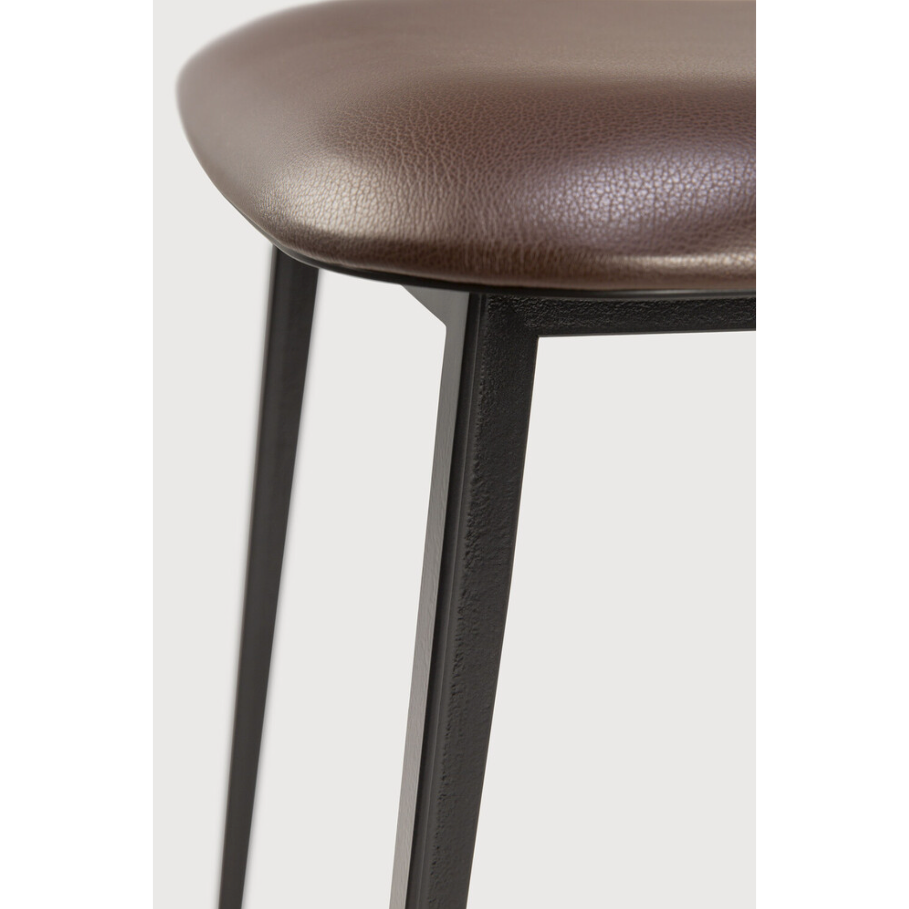 Featuring DC Dining Chair - Chocolate Leather by Ethnicraft at Amethyst Home. This DC Dining Chair is beautiful, minimalistic metal silhouette that would add an air of elegance to your dining table or kitchen. We love the details of the angled metal and the simplicity of this stunning chair.
Dimensions: 17"w x 19"d x 32.5"h Weight: 19 lbs
Seat Height: 20"
Mate.  Amethyst Home provides interior design, new home construction design consulting, vintage area rugs, and lighting in the Tampa metro area.