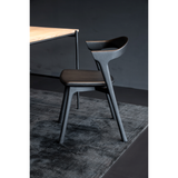 Featuring Oak Bok Dining Chair - Black - Black Leather by Ethnicraft at Amethyst Home. This Oak Bok Dining Chair features an airy shape with rock-solid construction,  making this piece a timeless and remarkable design to enjoy for years to come. Pair with a dining table or stand-alone against a wall, hallway, or end of the bed! Designed by Alain can Havre.  Amethyst Home provides interior design, new home construction design consulting, vintage area rugs, and lighting in the Washington metro area.