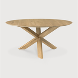 Featuring Oak Circle Round Dining Table by Ethnicraft at Amethyst Home. This Oak Circle Round Dining Table is all about inspiring your family to spend a little more time at the table. The solid legs intertwine in perfect balance to create a unique, bright look to any kitchen or dining area. 
Material: Oak, 100% Solid WoodFinish: Varnished
Dimensions 54": 5.  Amethyst Home provides interior design, new home construction design consulting, vintage area rugs, and lighting in the Charlotte metro area.