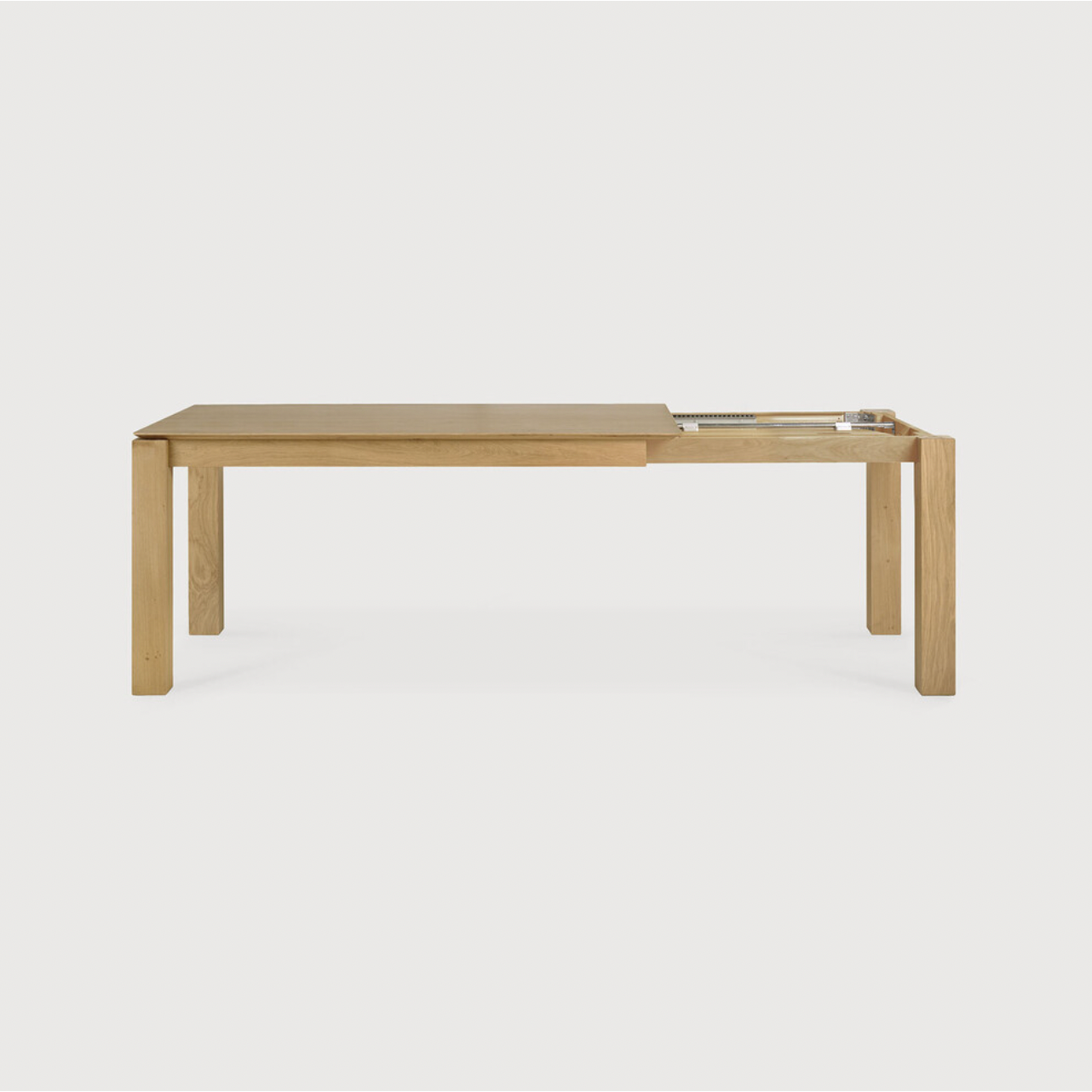 Featuring Oak Slice Extendable Dining Table by Ethnicraft at Amethyst Home. This Oak Slice Extendable Dining Table bevelled edges give it a unique character, but there's also a little extra added. This table can easily be extended without interruption of the wood grain pattern -- perfect for gathering your family or friends for hosting parties or the hol.  Amethyst Home provides interior design, new home construction design consulting, vintage area rugs, and lighting in the Kansas City metro area.