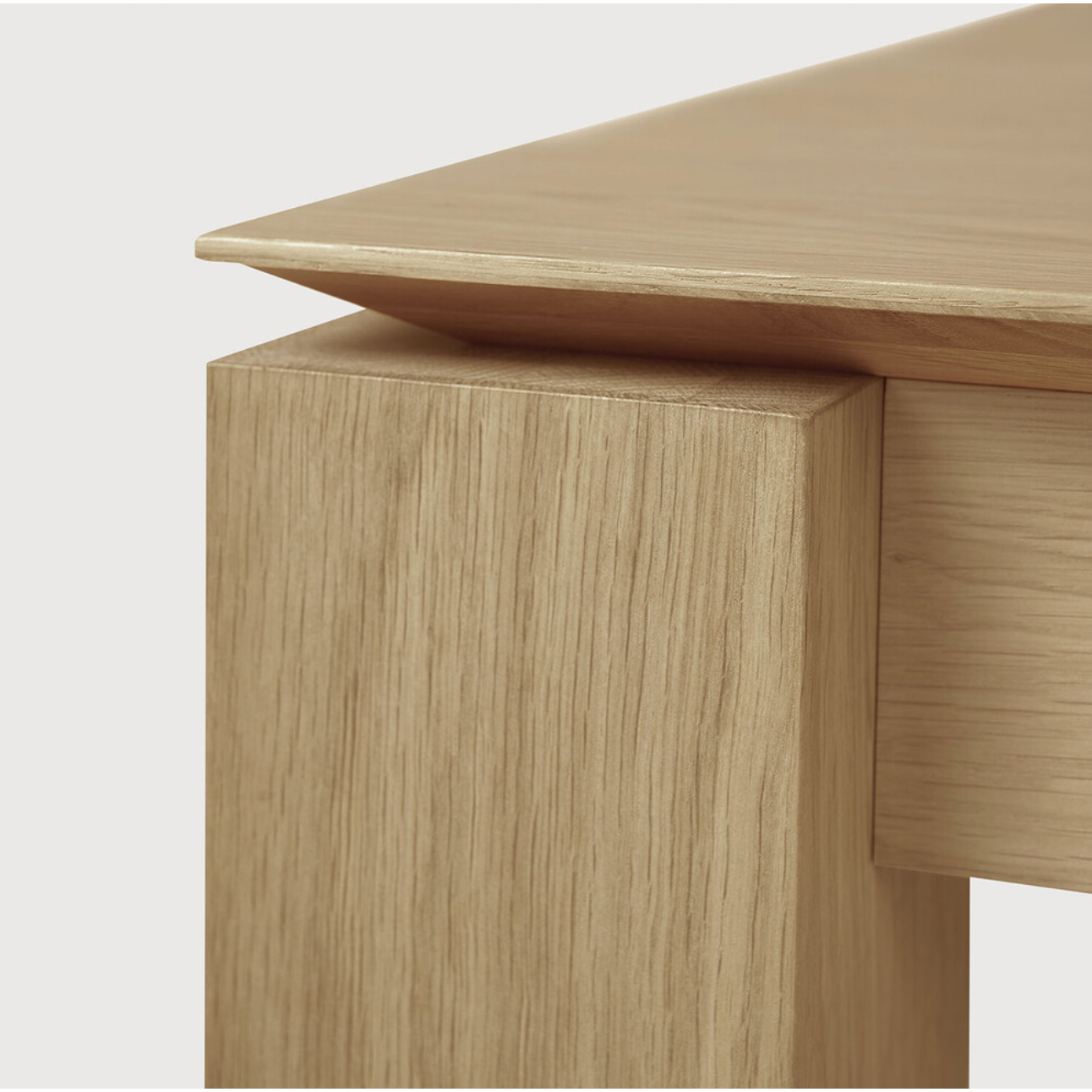 Featuring Oak Slice Extendable Dining Table by Ethnicraft at Amethyst Home. This Oak Slice Extendable Dining Table bevelled edges give it a unique character, but there's also a little extra added. This table can easily be extended without interruption of the wood grain pattern -- perfect for gathering your family or friends for hosting parties or the hol.  Amethyst Home provides interior design, new home construction design consulting, vintage area rugs, and lighting in the Kansas City metro area.