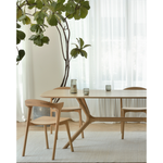 Featuring Oak X Dining Table by Ethnicraft at Amethyst Home. This Oak X Dining Table features sturdy, yet intricate, construction and is a true work of art and a credit to the most advanced woodworking techniques. With a seamless structural interplay between the unique shape of the legs and the soft lines of the tabletop, guests will enjoy the most comforta.  Amethyst Home provides interior design, new home construction design consulting, vintage area rugs, and lighting in the Portland metro area.