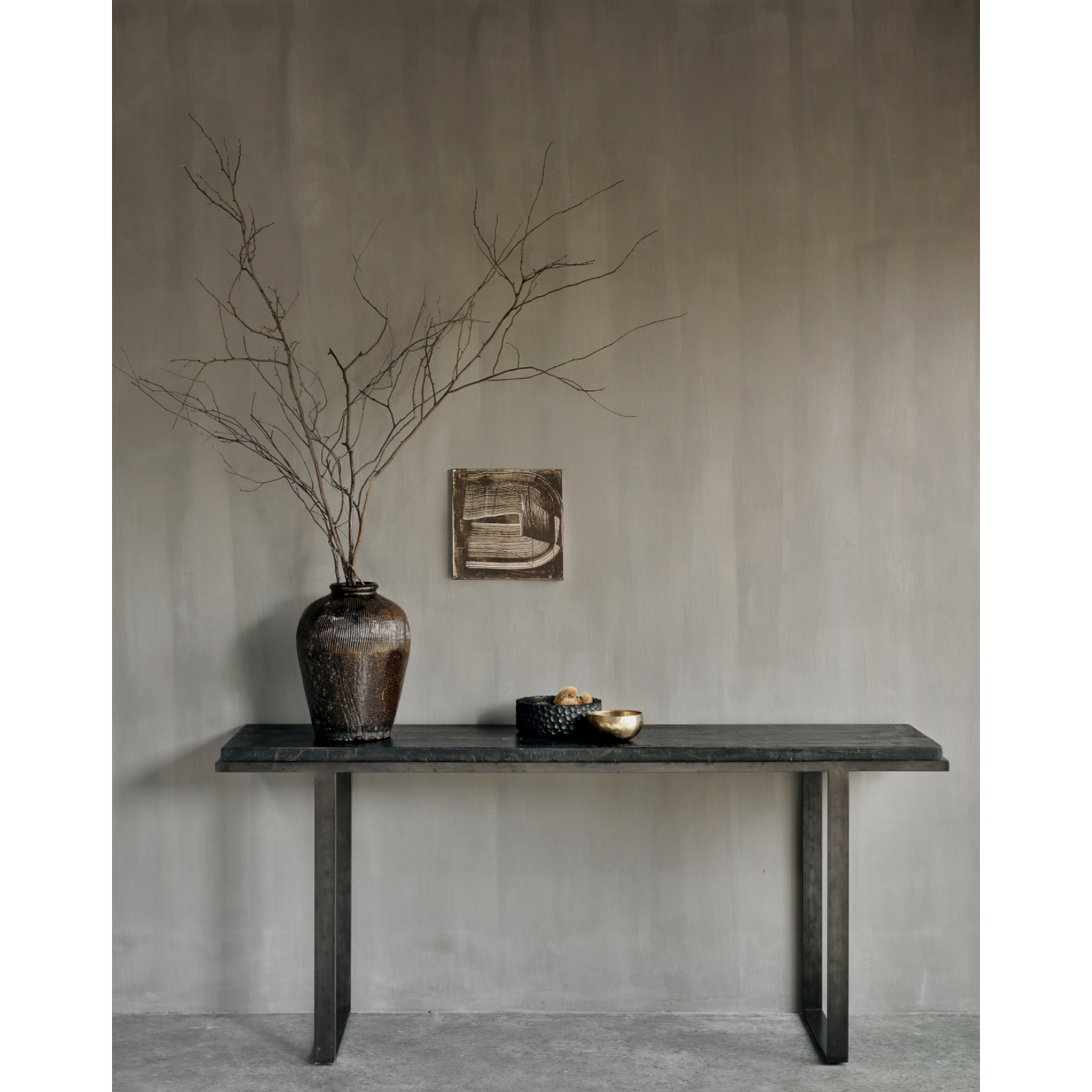 Featuring Stability Console Table - Umber by Ethnicraft at Amethyst Home. The deep surface of the Stability console is shaped by hand by skilled artisans. Natural mineral powders and color pigments blend to form the console's unique finish. We love how this piece's simple lines showcase the clean beauty of well-crafted metal work. We imagine this unique p.  Amethyst Home provides interior design, new home construction design consulting, vintage area rugs, and lighting in the Washington metro area.