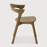 Featuring Teak Bok Dining Chair by Ethnicraft at Amethyst Home. This Teak Bok Dining Chair features an airy shape with rock-solid construction,  making this piece a timeless and remarkable design to enjoy for years to come. Pair with a dining table or stand-alone against a wall, hallway, or end of the bed! Designed by Alain can Havre
Dimensions: 20"w x 21.5"d.  Amethyst Home provides interior design, new home construction design consulting, vintage area rugs, and lighting in the Boston metro area.