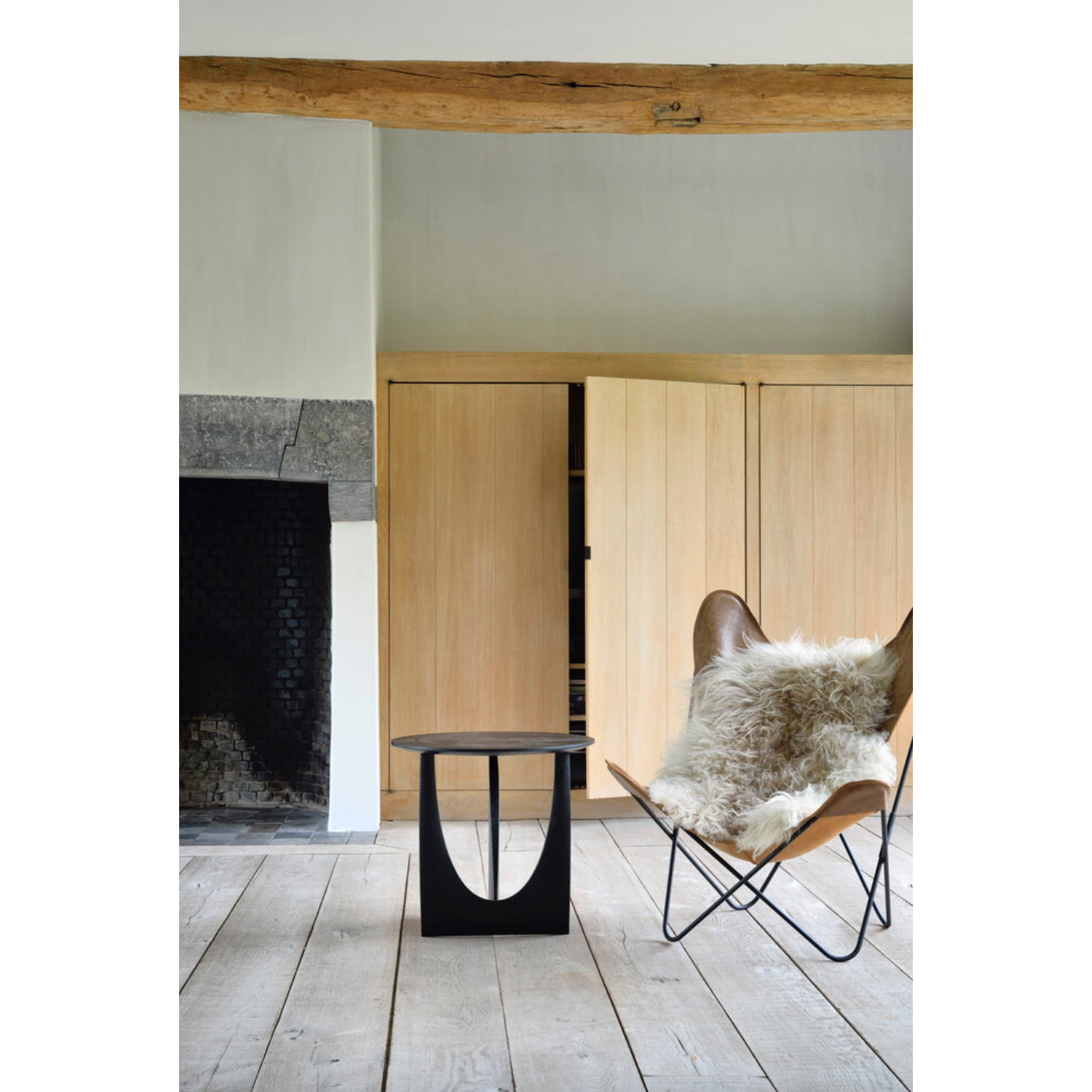 Featuring Oak Geometric Side Table - Black by Ethnicraft at Amethyst Home. From any angle, the Oak Geometric Side Table does not only look different, it also becomes different. We love seeing this table as a sculptural accent to your living space or office.Designed by Alain van Havre
Dimensions: 20.5"w x 20.5"d x 20"h Weight: 11 lbs
Material: OakFinish: Varn.  Amethyst Home provides interior design, new home construction design consulting, vintage area rugs, and lighting in the Houston metro area.