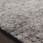 Hand-knotted in India of 100% wool, the Amara Ivory/Taupe Area Rug creates a casual yet refined vibe with high-end appeal. With shades of ivory, taupe, and black, this is a gorgeous rug to showcase in your living room, entryway, bedroom, or other high traffic area.   Hand Knotted 100% Wool AMM-04 Ivory/Taupe