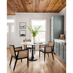 Featuring Antonia Cane Brushed Ebony Dining Armchair by Four Hands at Amethyst Home. We loved the retro look of this Antonia Cane Dining Armchair - Brushed Ebony. The brushed ebony nettlewood frames paired with the natural cane brings the perfect contract to any dining room or kitchen area. 
Overall Dimensions: 22.75"W x 23.50"L x 33"HColors: Light Natur.  Amethyst Home provides interior design, new home construction design consulting, vintage area rugs, and lighting in the Los Angeles metro area.