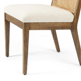 Featuring Charlotte Armless Dining Chair - Cane Toasted Nettlewood by Four Hands at Amethyst Home. Coastal aesthetic and daily comfort -- the Charlotte Dining Chair is an Amethyst fave.  It's perfect for blending wood tones in a space due to the two tone cane back.  Upholstered in a performance fabric for stress-free daily use.
Overall Dimensions: 22.50"W.  Amethyst Home provides interior design, new home construction design consulting, vintage area rugs, and lighting in the Washington metro area.