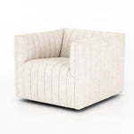 Featuring Augustine Swivel Chair - Cream by Four Hands at Amethyst Home. You will love the dramatic channeling of this Augustine Cream Swivel Chair. The swivel feature sets this apart from other chairs and is a great choice for any living room or media room. This chair is comfort wrapped in soft linen blend making this everyone's favorite chair.Overall Dimen.  Amethyst Home provides interior design, new home construction design consulting, vintage area rugs, and lighting in the Houston metro area.