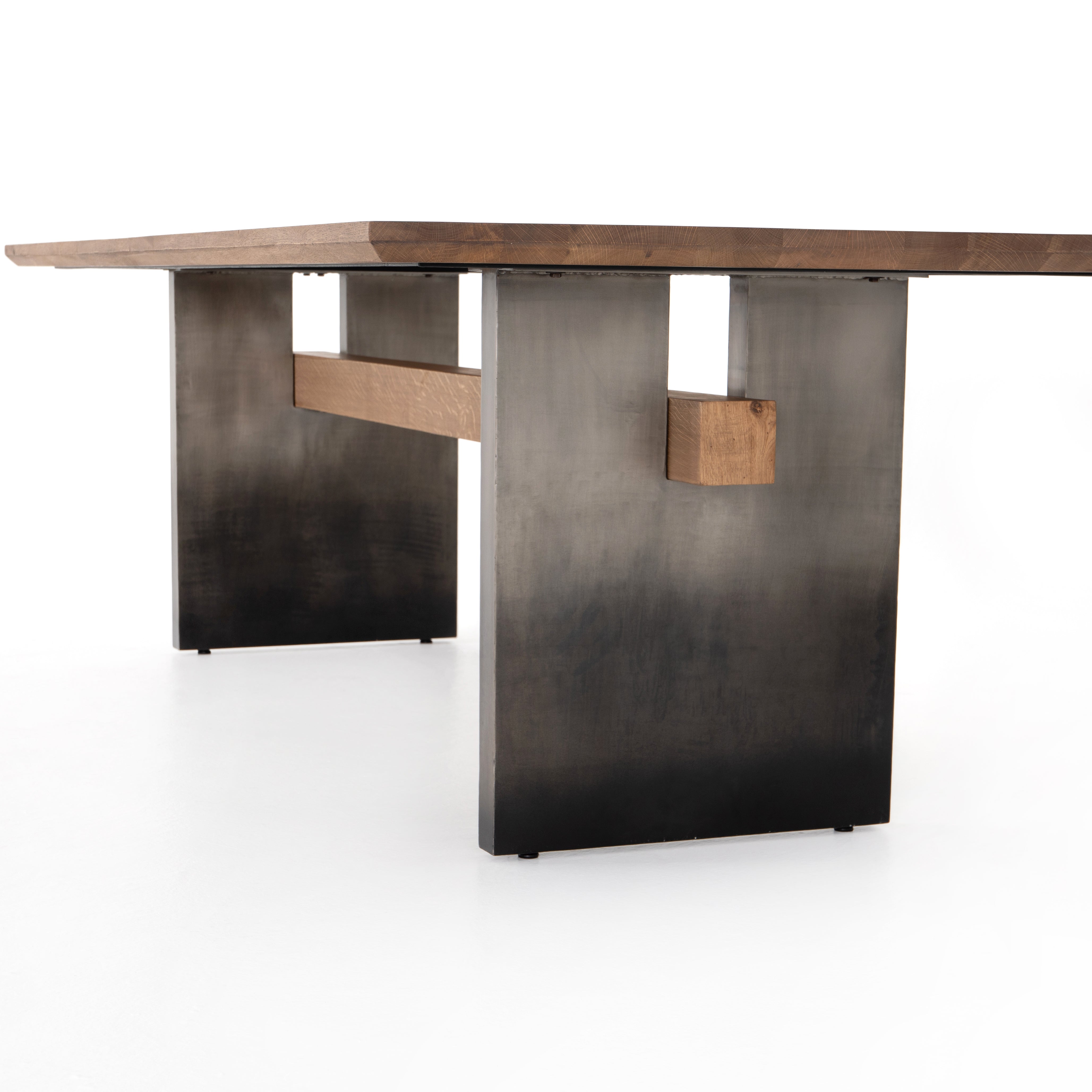 Featuring Brennan Dining Table - Dove Oak by Four Hands at Amethyst Home. This Brennan Dining Table - Dove Oak has a rectangular soft-grey oak tabletop and flaunts its materials' natural graining, for a richly organic takeaway. Wide, plank-style legs of pewter-finished steel features an ombre pattern -- a statement piece for any dining room or kitchen .  Amethyst Home provides interior design, new home construction design consulting, vintage area rugs, and lighting in the Newport Beach metro area.