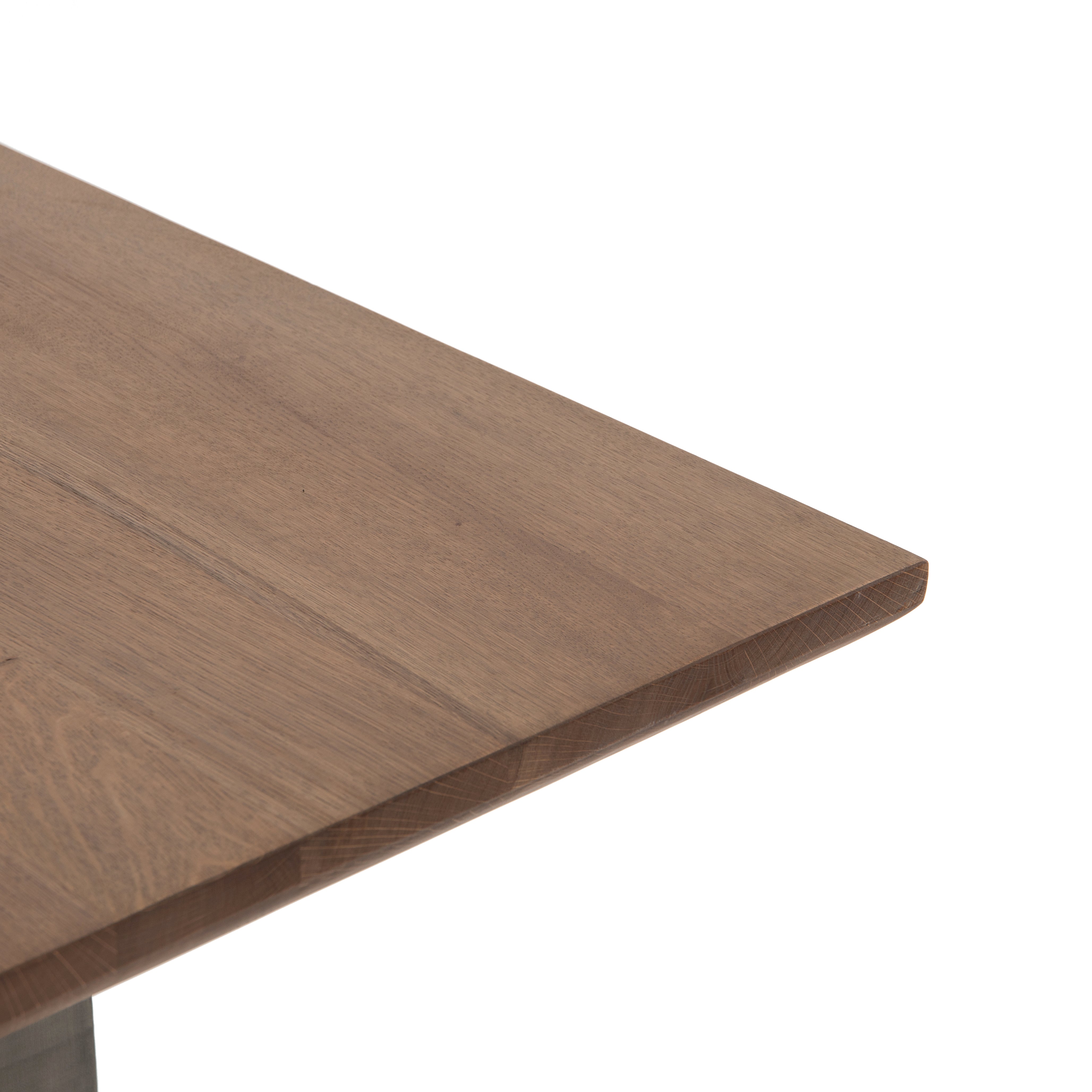 Featuring Brennan Dining Table - Dove Oak by Four Hands at Amethyst Home. This Brennan Dining Table - Dove Oak has a rectangular soft-grey oak tabletop and flaunts its materials' natural graining, for a richly organic takeaway. Wide, plank-style legs of pewter-finished steel features an ombre pattern -- a statement piece for any dining room or kitchen area.  Amethyst Home provides interior design, new home construction design consulting, vintage area rugs, and lighting in the Charlotte metro area.