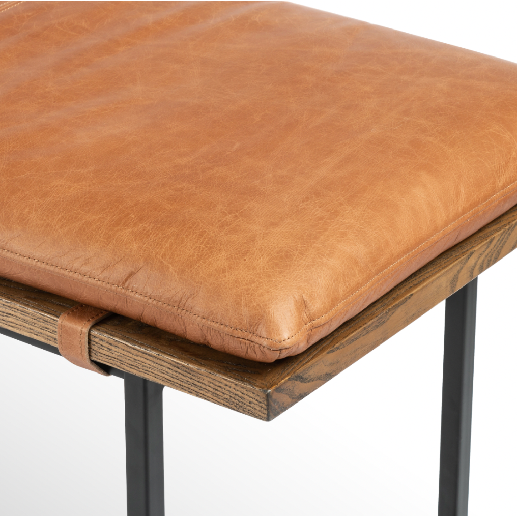 Featuring Gabine Accent Bench - Brandy by Four Hands at Amethyst Home. Airy, black-finished iron legs support a nettlewood dining bench of a chic, comfy layer of brandy top-grain leather on this Gabine Accent Bench - Brandy. A handsome piece to add to any bedroom, living room, or entryway. 
Overall Dimensions: 72"W x 18"L x 22"H
Colors: Midnight Iron, Toas.  Amethyst Home provides interior design, new home construction design consulting, vintage area rugs, and lighting in the Calabasas metro area.