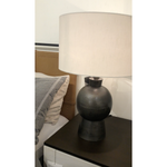 Featuring Kelita Textured Black Table Lamp by Four Hands at Amethyst Home. Textured black aluminum forms a shapely base to beautifully complement a white silk shade with this Kelita Textured Black Table Lamp. A beautiful lamp to place next your bed, sofa, or other area needing extra light.
Overall Dimensions: 16"W x 16"L x 25"H
Colors: Textured Black Aluminum,.  Amethyst Home provides interior design, new home construction design consulting, vintage area rugs, and lighting in the Tampa metro area.