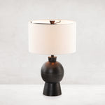 Featuring Kelita Textured Black Table Lamp by Four Hands at Amethyst Home. Textured black aluminum forms a shapely base to beautifully complement a white silk shade with this Kelita Textured Black Table Lamp. A beautiful lamp to place next your bed, sofa, or other area needing extra light.
Overall Dimensions: 16"W x 16"L x 25"H
Colors: Textured Black Aluminum.  Amethyst Home provides interior design, new home construction design consulting, vintage area rugs, and lighting in the Boston metro area.