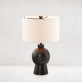 Featuring Kelita Textured Black Table Lamp by Four Hands at Amethyst Home. Textured black aluminum forms a shapely base to beautifully complement a white silk shade with this Kelita Textured Black Table Lamp. A beautiful lamp to place next your bed, sofa, or other area needing extra light.
Overall Dimensions: 16"W x 16"L x 25"H
Colors: Textured Black Aluminum.  Amethyst Home provides interior design, new home construction design consulting, vintage area rugs, and lighting in the Boston metro area.