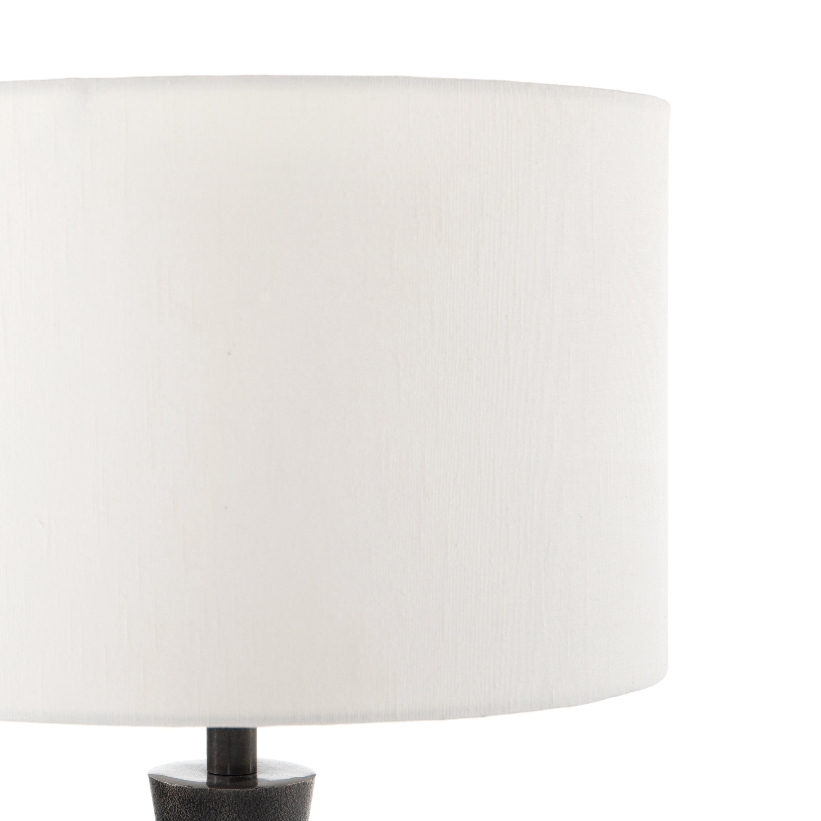 Featuring Kelita Textured Black Table Lamp by Four Hands at Amethyst Home. Textured black aluminum forms a shapely base to beautifully complement a white silk shade with this Kelita Textured Black Table Lamp. A beautiful lamp to place next your bed, sofa, or other area needing extra light.
Overall Dimensions: 16"W x 16"L x 25"H
Colors: Textured Black Aluminum,.  Amethyst Home provides interior design, new home construction design consulting, vintage area rugs, and lighting in the Tampa metro area.