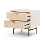 Featuring Luella Nightstand - Matte Alabaster by Four Hands at Amethyst Home. Bring a light look to bedroom styling with this Luella Nightstand - Matte Alabaster. The two-drawer nightstand features woven cane panels and half-moon hardware finished in an aged brass.
Overall Dimensions: 24"W x 18"L x 24"H
Colors: Matte Alabaster, Light Natural Cane, Aged Bra.  Amethyst Home provides interior design, new home construction design consulting, vintage area rugs, and lighting in the Calabasas metro area.