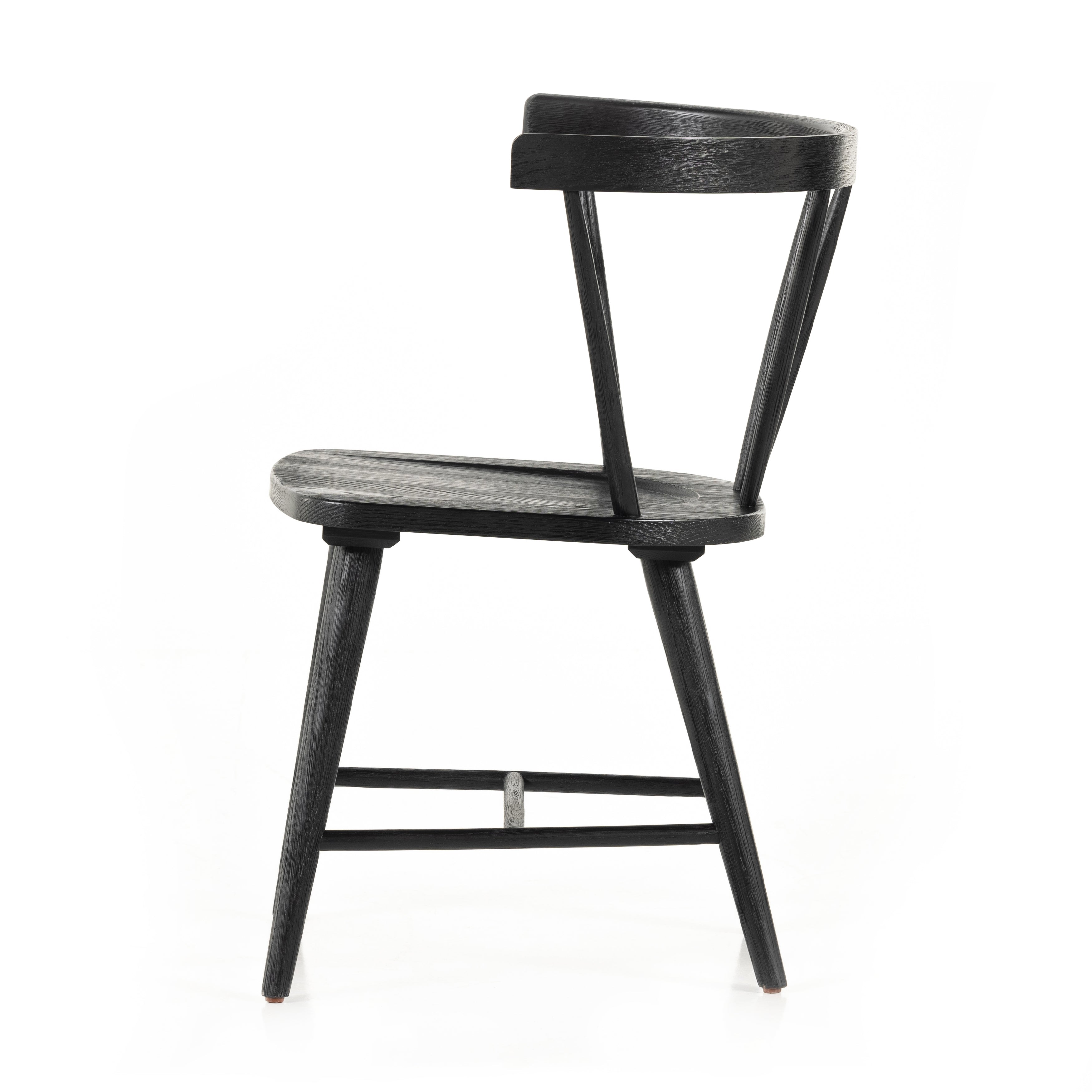 Featuring Naples Dining Chair - Black Oak by Four Hands at Amethyst Home. This Naples Dining Chair - Black Oak is a fresh twist on traditional Windsor-style seating is crafted from solid black-finished oak, for a look that’s always in style.
Overall Dimensions: 20.50"W x 21.50"L x 31.75"HColors: Black Oak, Black Oak VeneerMaterials: Solid Oak, Oak VeneerW.  Amethyst Home provides interior design, new home construction design consulting, vintage area rugs, and lighting in the Washington metro area.